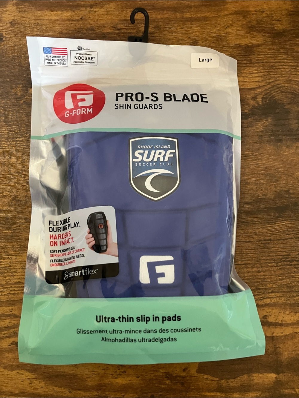 Pro-S Blade Blue Shin Guards Ultra Thin Slip In Large RI Surf Soccer Club logo